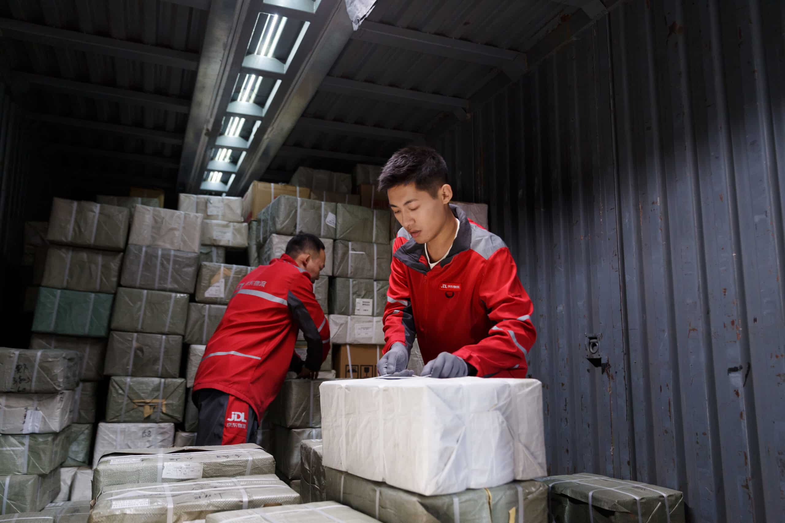 JD Logistics frontline employees handling customer deliveries